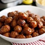 instant pot grape jelly meatballs with sweet chili sauce in serving bowl