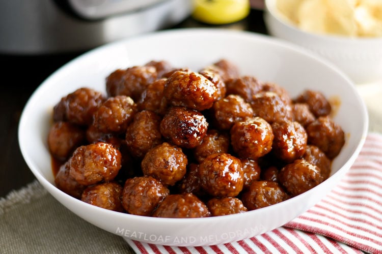 instant pot grape jelly meatballs with sweet chili sauce in serving bowl