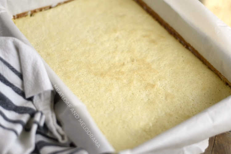 easy lemon bars baked in pan with parchment paper