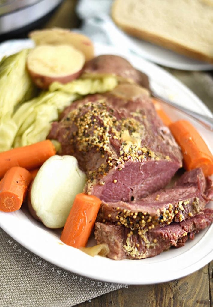 instant pot corned beef and cabbage flat cut with potatoes and carrots on platter