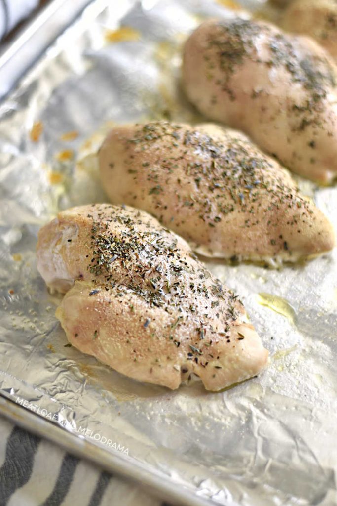 easy baked chicken breasts out of the oven on tray