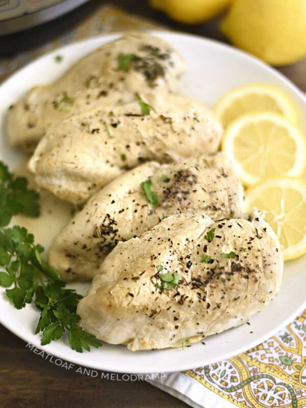 cooked instant pot chicken breasts on serving platter