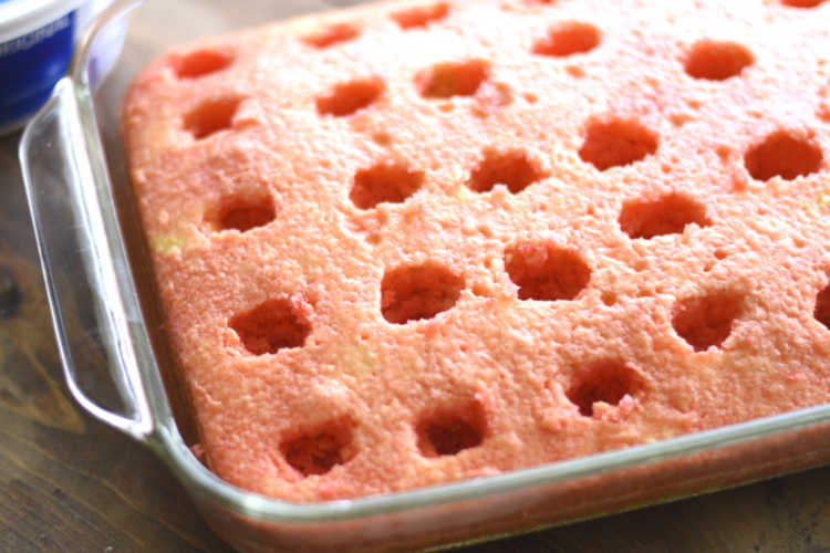 cake with holes and jello poured over