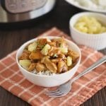 instant pot hawaiian bbq chicken over rice in a bowl with pineapples