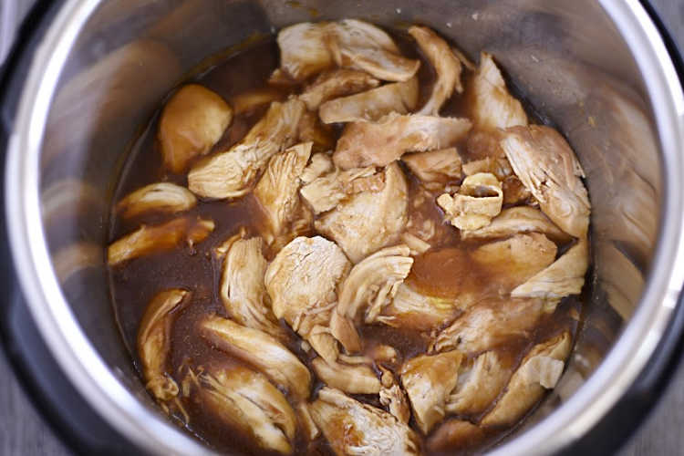 pressure cooked teriyaki chicken in sauce in instant pot