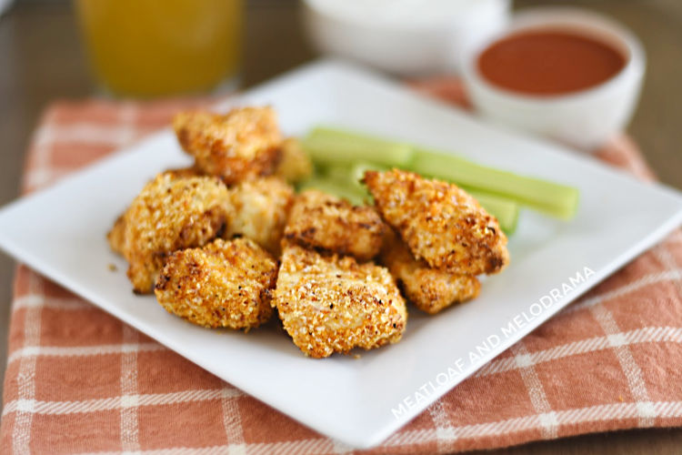 air fryer buffalo chicken nuggets on plate with celery