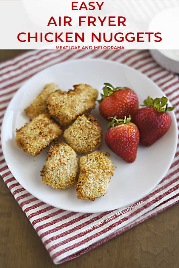 breaded chicken nuggets on a plate with strawberries