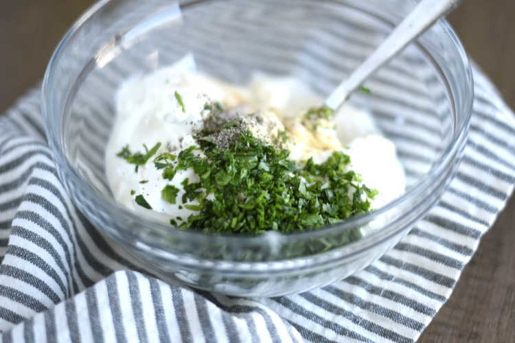 ingredients to make homemade ranch in glass mixing bowl