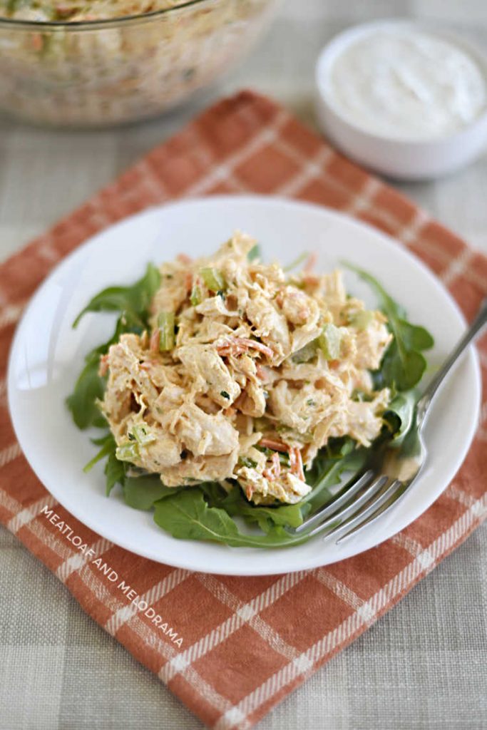 plate of instant pot buffalo chicken salad over arugula with ranch