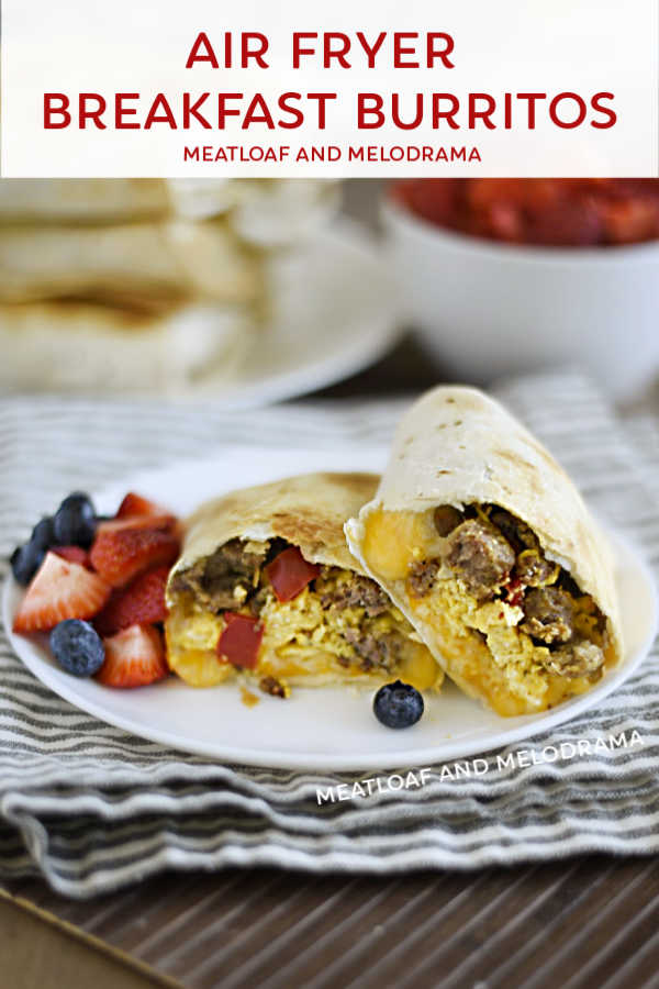 air fryer breakfast burritos on a plate with fresh fruit