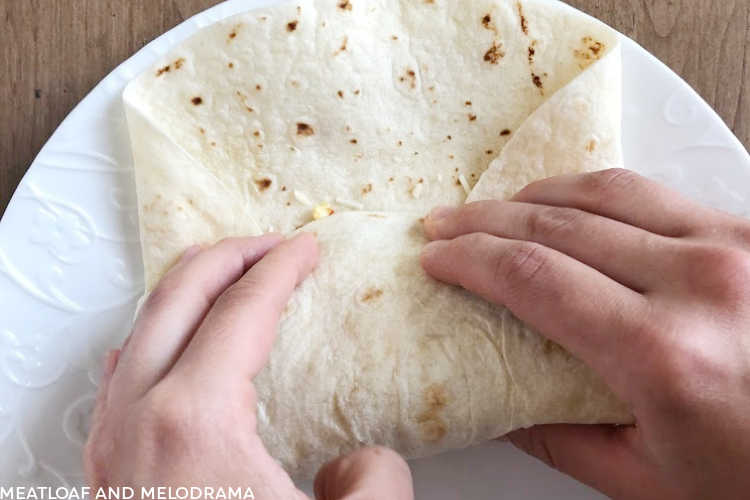 roll tortilla over to make breakfast burrito