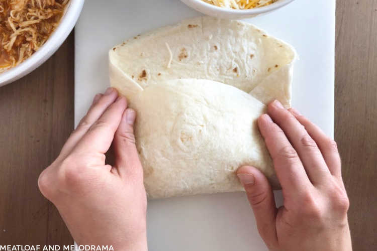 roll tortilla up over chimichanga filling