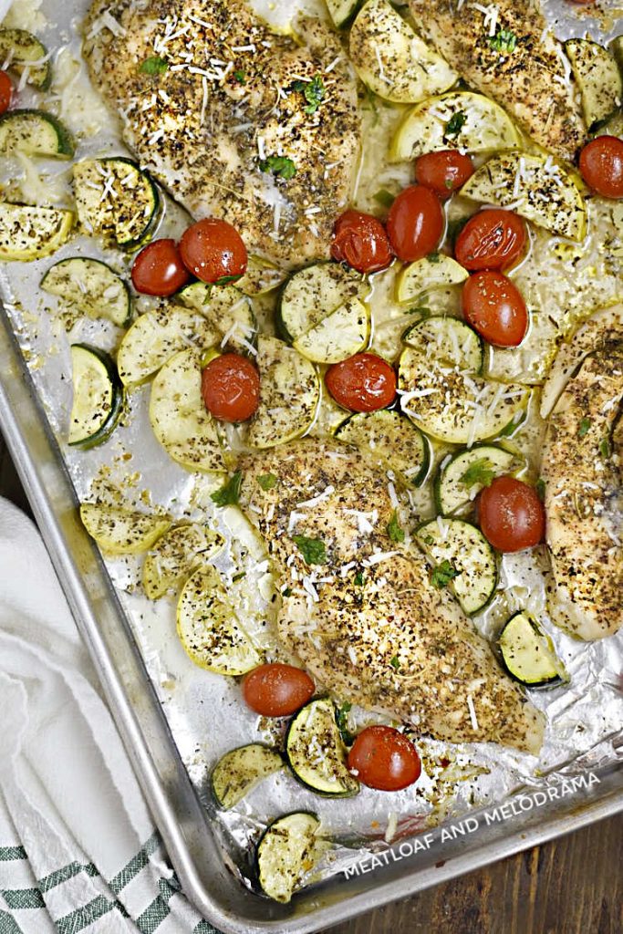 baked chicken breasts with summer vegetables on sheet pansheet pan 