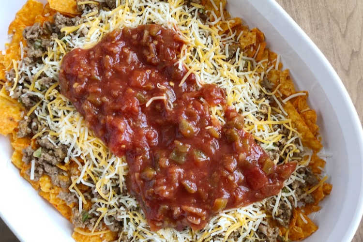how to layer doritos, ground beef, shredded cheese and salsa in baking dish