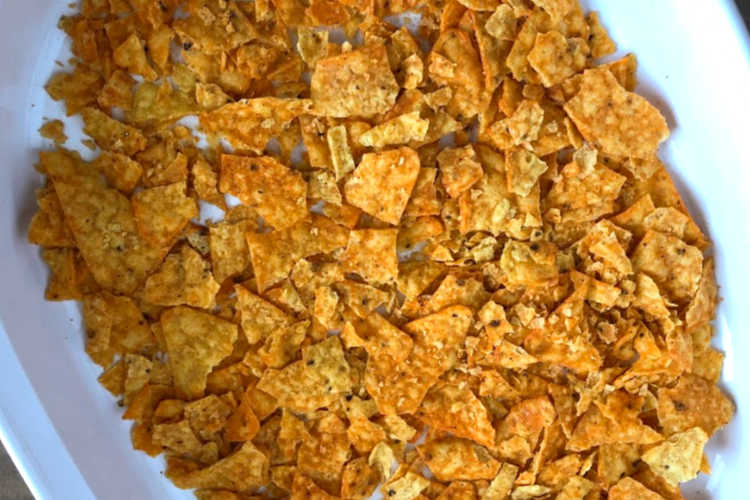 crushed doritos nacho cheese chips in baking dish