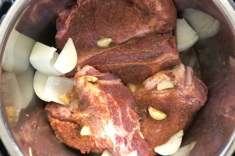 pork shoulder in instant pot with onions and garlic