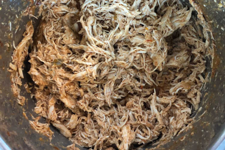 shredded chicken breast meat in pressure cooker