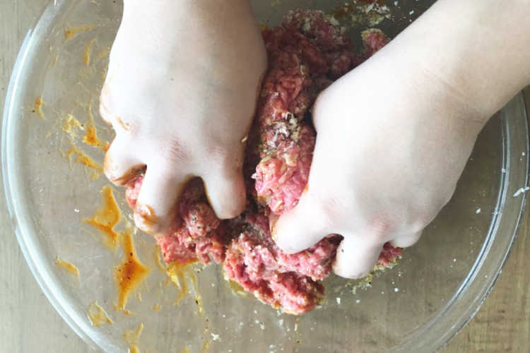 mix bbq meatloaf ingredients with hands