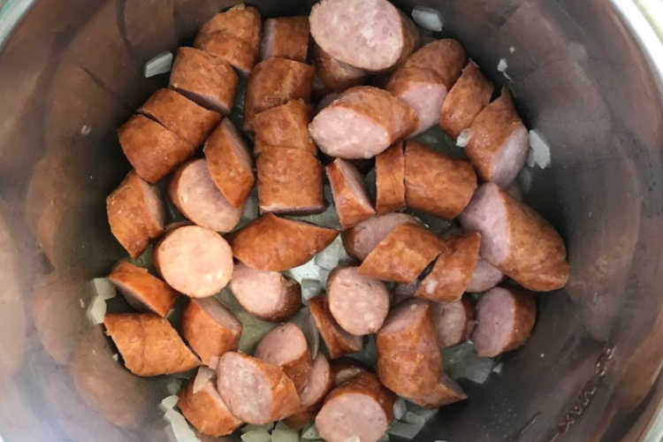 cook onions and sliced kielbasa in pressure cooker