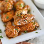 air fryer buffalo chicken wings on a white platter