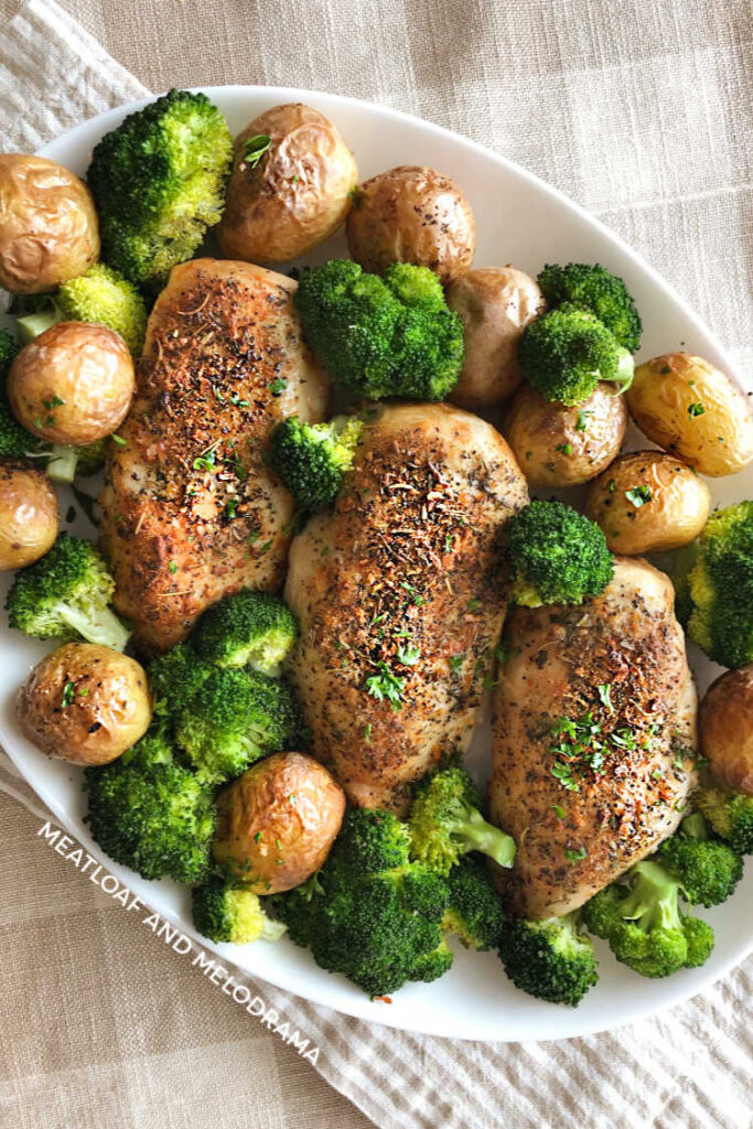 platter with air fried chicken breasts, baby potatoes and broccoli