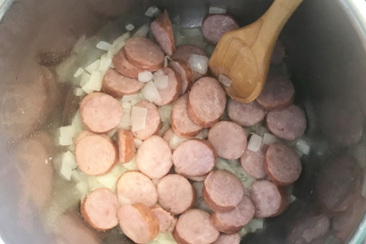 browning onions and kielbasa slices on saute mode in instant pot