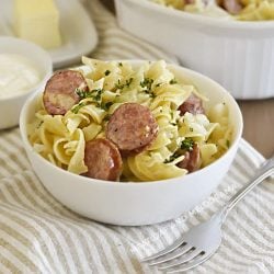 instant pot cabbage and noodles and kielbasa in white bowl
