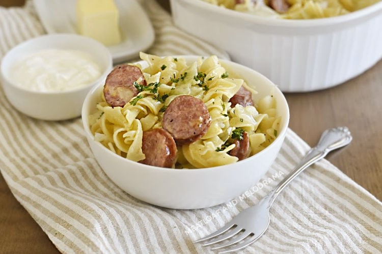 instant pot cabbage and noodles and kielbasa in white bowl