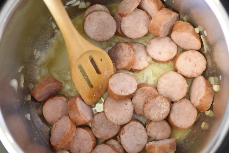 brown kielbasa and onions in the pressure cooker