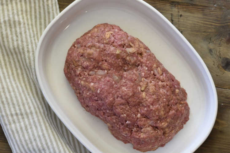 uncooked meatloaf in casserole dish