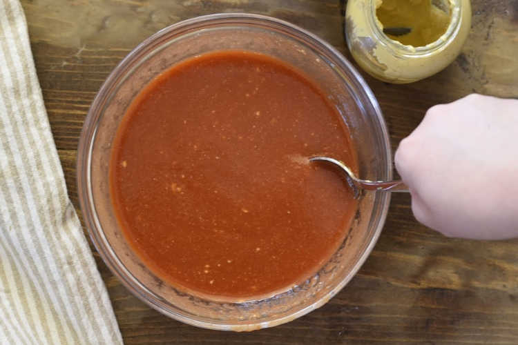 mix together brown sugar tomato sauce glaze for meatloaf in bowl