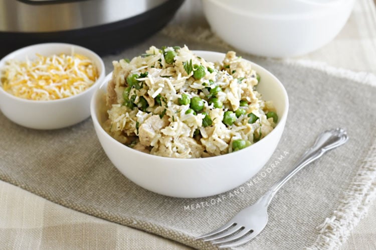 bowl of chicken and rice with peas made in the instant pot pressure cooker