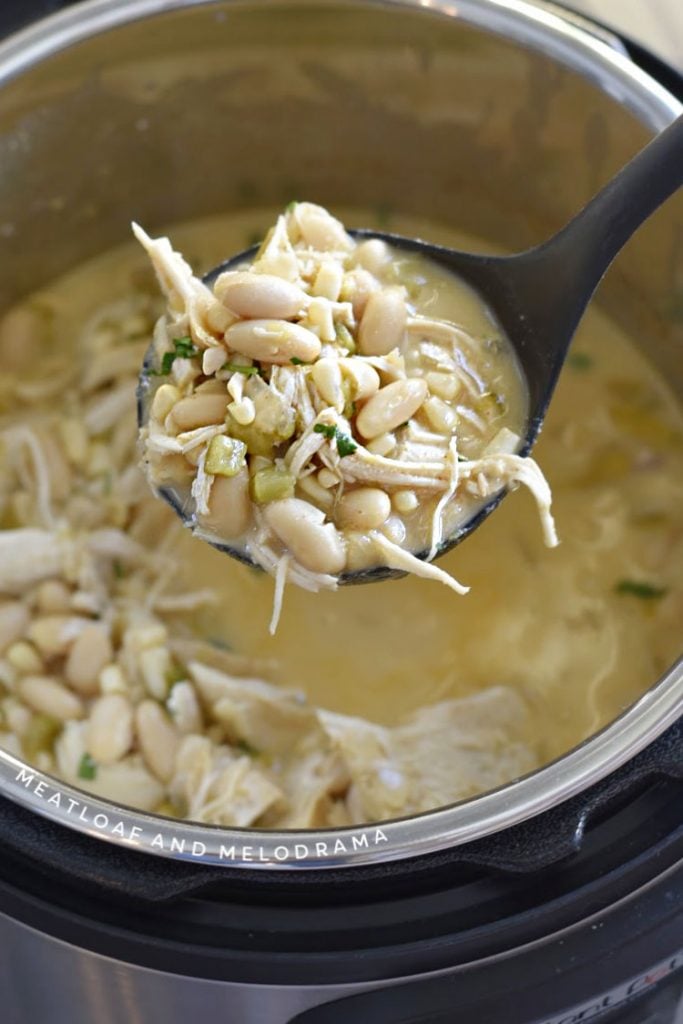 chicken chili with white beans on a ladle in the instant pot 