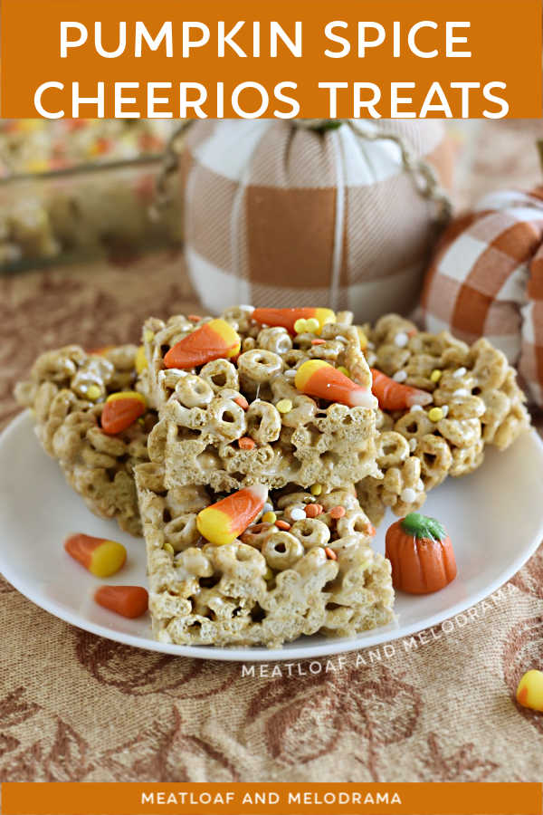 Pumpkin Spice Cheerios Treats with candy corn and fall candy on a plate with pumpkins