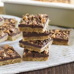 toffee bars with shortbread crust and chocolate butterscotch chips stacked up
