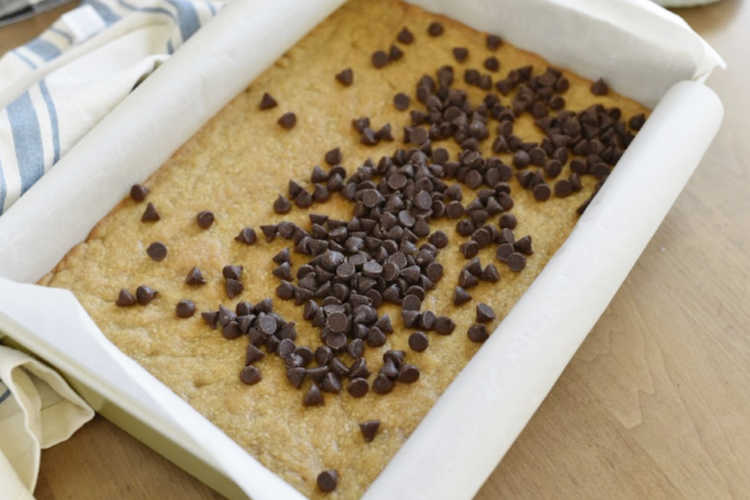 melt chocolate chips over shortbread crust