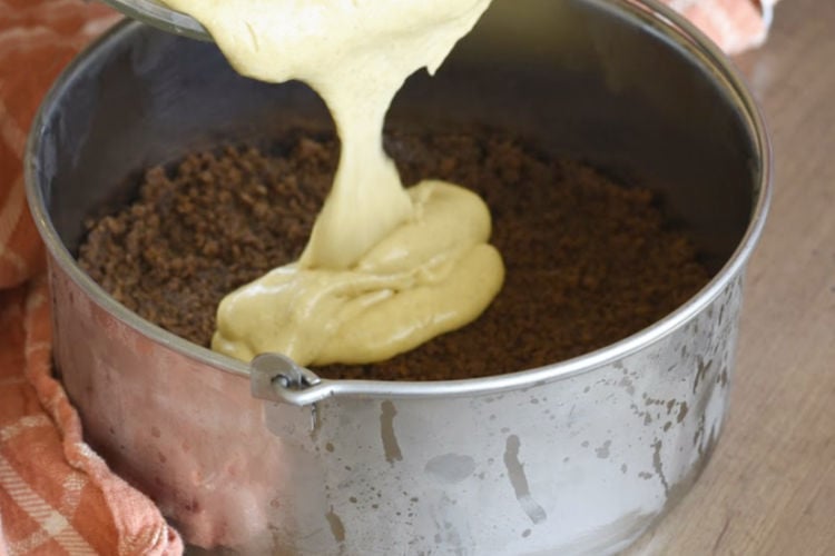 pour cheesecake filling over gingerbread crust in 7 inch springform pan
