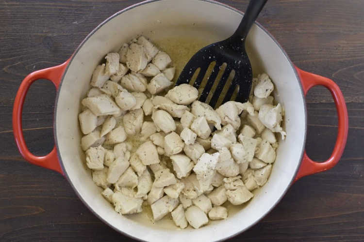 diced chicken breasts in red dutch oven