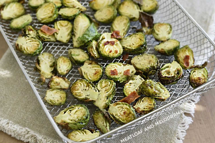 air fried brussels sprouts with bacon and parmesan cheese in airy fryer tray