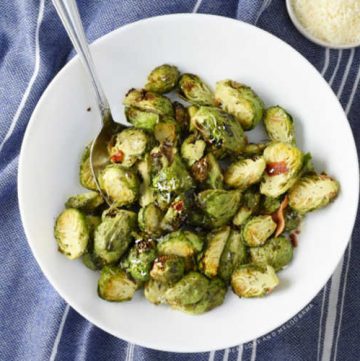 bowl of Brussels sprouts with Parmesan and bacon cooked in the air fryer