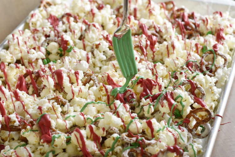 drizzle red and green candy melts over popcorn and pretzels