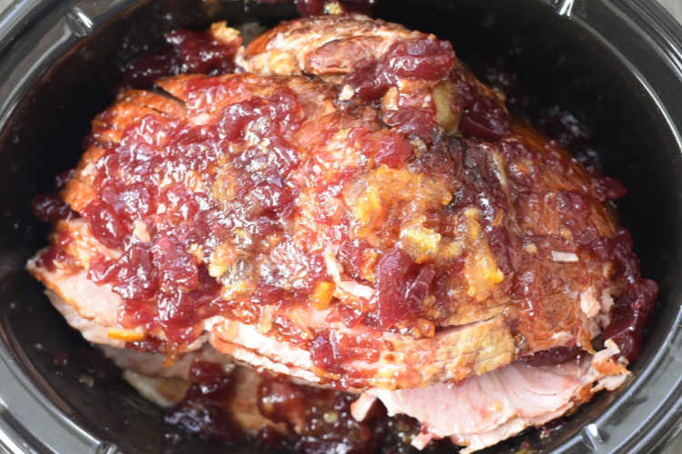 Christmas ham with jellied cranberry sauce and orange marmalade in slow cooker