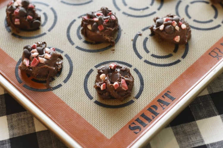 chocolate cake mix cookies with peppermint chips on baking sheet
