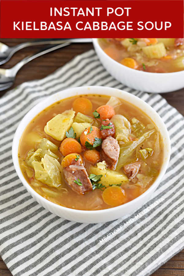 instant pot kielbasa cabbage soup with carrots and potatoes in a white bowl