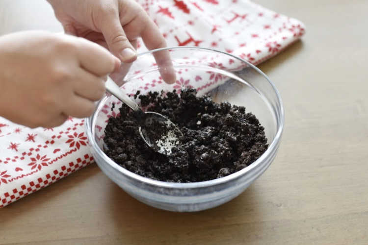 mix butter with crushed oreo cookies in bowl