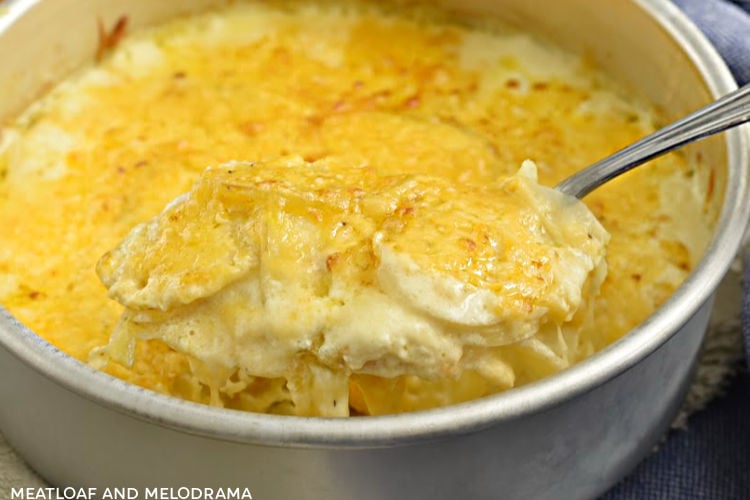 instant pot potatoes au gratin on serving spoon