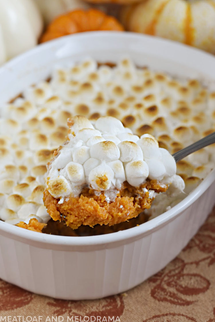 sweet potato casserole with fluffy marshmallows on spoon