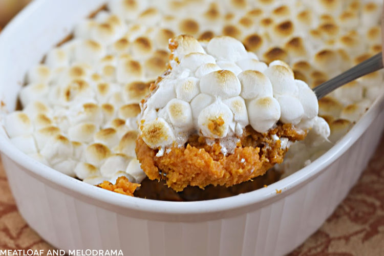 sweet potato casserole with marshmallow topping on a spoon
