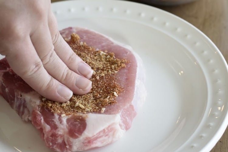 spread dry rub on bone in pork chop