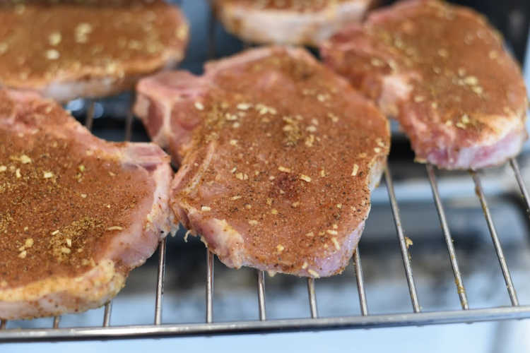 seasoned pork chops on air fryer rack